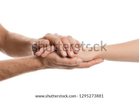 Man comforting woman on white background, closeup of hands. Help and support concept Royalty-Free Stock Photo #1295273881