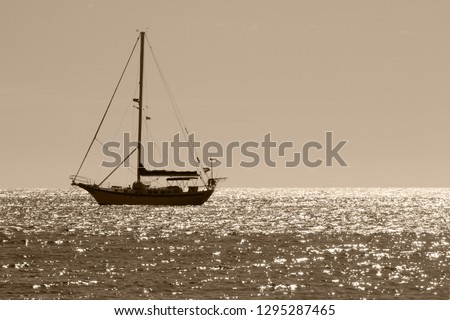 Sailing yacht on the sparkling sea, with color toning effect