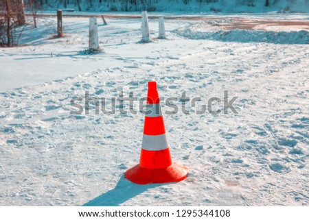 road warning sign on the snowy road 