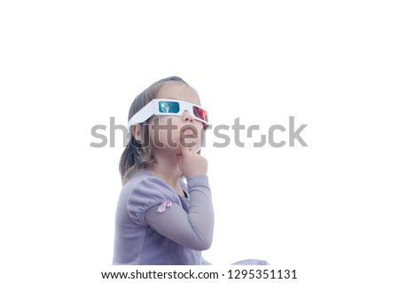 thinking idea little baby girl in 3D anaglyph cinema glasses for stereo image system with polarization. 3D googles with red and blue eyes