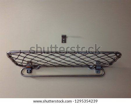 Shelf on the wall with a grid