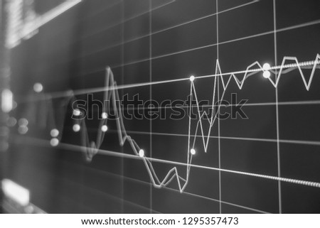 Stock exchange market in black and white on LED screen. Finance and economic concept. 