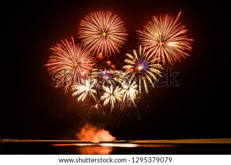 Colorful fireworks of various colors at night with new year celebration and national day anniversary concept. - Image