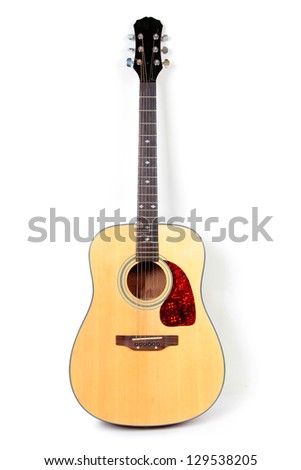 Color photo of an acoustic guitar on a white background Royalty-Free Stock Photo #129538205