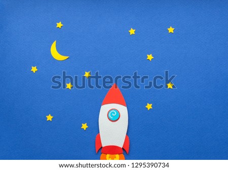 The launch into space. Flying rocket through the clouds. Start up of the space rocket. Rocket ship in flat design on blue background. 3d paper . Concept of business launch. Paper cut.