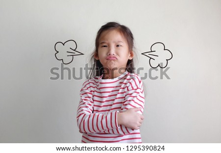 Asian Little girl is angry And cross one's arm with white background. Drawing of blowing Steam coming out of ear.