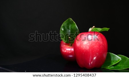 Ripe apple fruit with leaf on black background. Fruit image