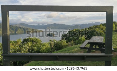 New Zealand Marlborough Sounds through a picture frame with picnic table