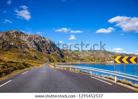 Scenic mountain road along a lake, Vest-Agder county, Norway, Scandinavia