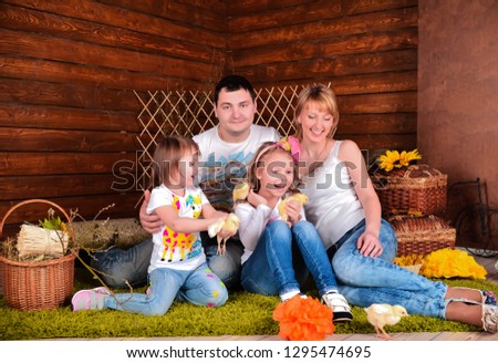 dad, mom and two beautiful girls take pictures in the studio with chickens