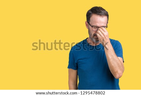 Handsome middle age hoary senior man wearin glasses over isolated background tired rubbing nose and eyes feeling fatigue and headache. Stress and frustration concept. Royalty-Free Stock Photo #1295478802