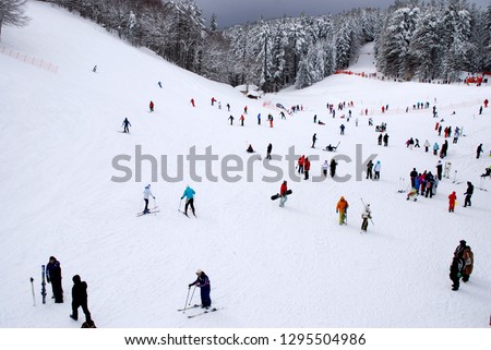 skiers on the dale meeting place at the end of the ski slope sila mountains calabria italy