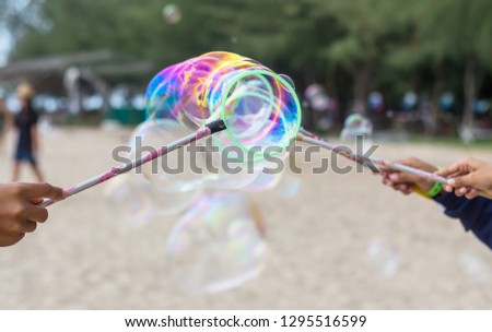 Soap bubbles floating in the air as the Summer sun sets 