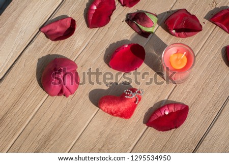 Single heart with sweet candles on wooden texture background. Valentines day card concept. Heart for Valentines Day Background