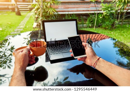 Freelancer working on a laptop and vacation. 