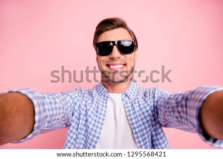 Close up photo of amazing brunet he him his handsome telephone make take selfie in black summer specs delight vacation rest relax period wear casual checkered shirt outfit isolated on rose background
