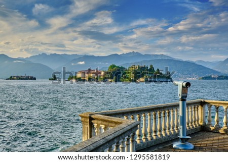 In Stresa Italy, on the shore of Lake Maggiore looking out over the Barromean islands in the evening light. Royalty-Free Stock Photo #1295581819