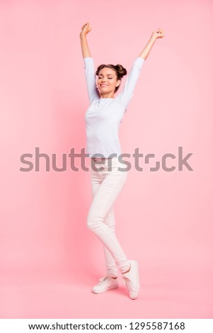 Vertical full length body size view portrait of nice winsome attractive slim fit thin cheerful dreamy girl stretching isolated over pink pastel background