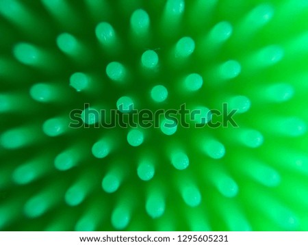 Background of neon glow sticks. Green abstract texture. Green neon color
