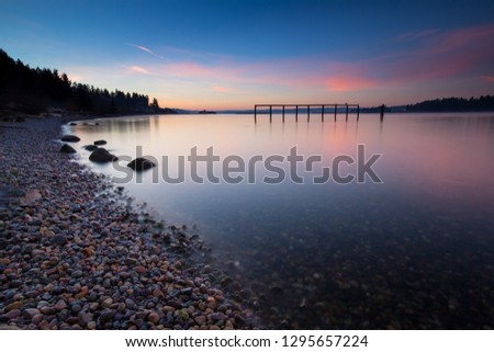 Calm water and colorful sky, Fort Ward, Bainbridge Island, Washington, USA Royalty-Free Stock Photo #1295657224