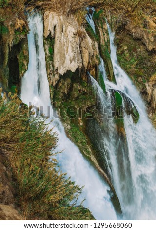 Vertical photo of beautiful Lower Duden waterfall in Antalya city, Turkey country, Mediterranean sea. Vertical color photography.