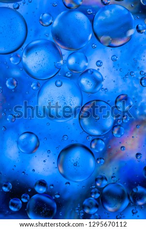 Close-up water and oil abstract in a rainbow lighting effect