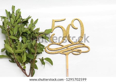50 years celebration. Wooden topper for cake.