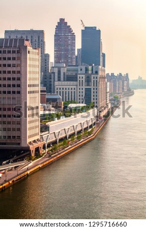 Aerial view of Manhattan skyline viewed from East River during sunny summer day