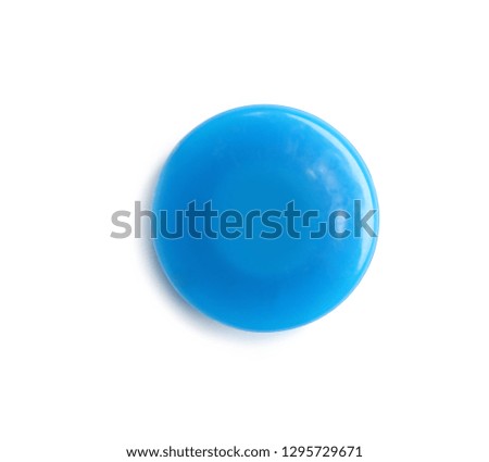 Bright blue plastic magnet on white background, top view