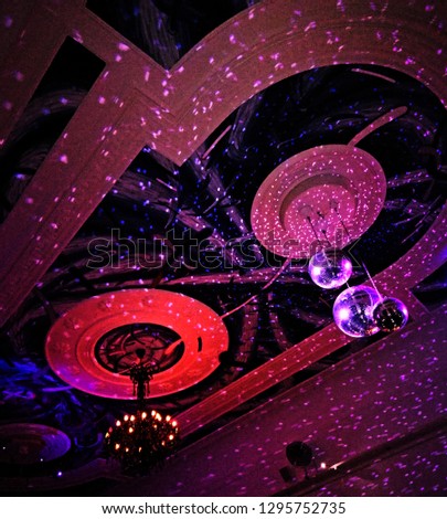 Chandelier and disco balls at night club 