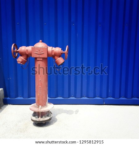 an isolated fire hydrant on a blue background