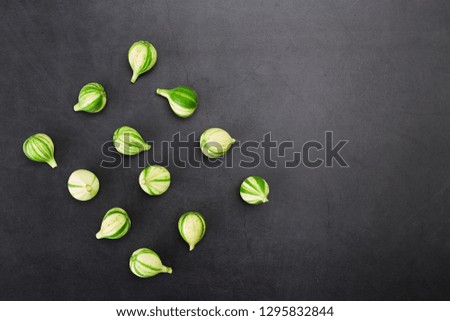 Fresh figs Bordissot Negra Rimada tree, producting its variegated and colorful fruits on dark rustic background, Flat lay. Nature concept, Free space