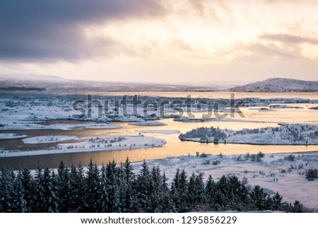 Icelandic Nature and Landscape - Iceland Tours. snow desert winter landscape in iceland. Thingvellir valley under the snow in the rift of continental plates. Winter view. beautiful sunright.