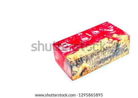 Casting epoxy resin Stabilizing Afzelia burl wood red lava on white background, Beautiful abstract art picture photo