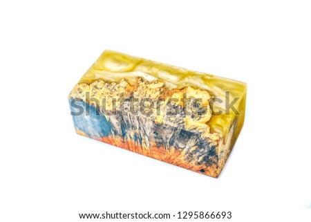 Casting epoxy resin Stabilizing Afzelia burl wood yellow on white background, Abstract art picture photo