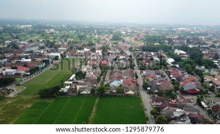 Cloudy sky over Yogyakarta village, shot from drone