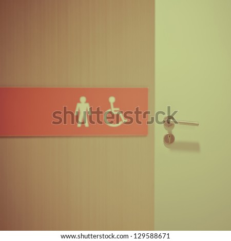 toilet sign on wall - colorized photo
