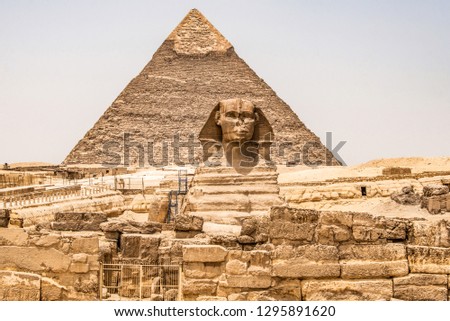 Egyptian Great Sphinx full body portrait head,with pyramids of Giza background Egypt empty with nobody. copy space