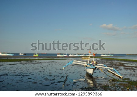 anchored boats in watudodol beach in Banyuwangi