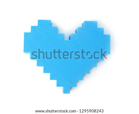 Plastic heart figure on white background, top view