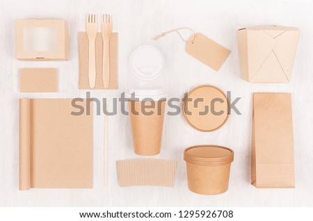 Fast food template for branding identity - blank kraft paper notebook, coffee cup, label, card, box for noodles, sushi, soup  on white wood board.