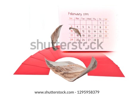 Red envelopes overlapping isolated on white background. Chinese New Year gift. with calendar and money.