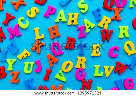 colored letters on blue background