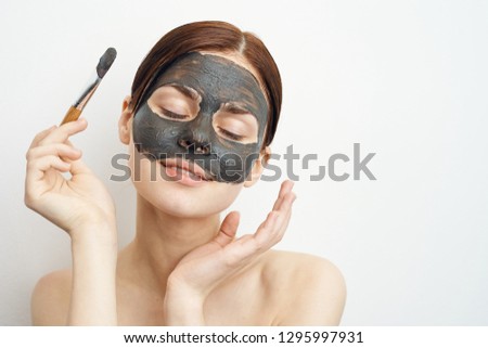 care for every cosmetic mask of clay young woman with closed eyes