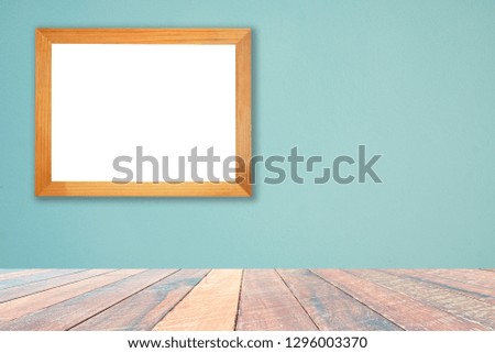 Green wall and empty wood desk and Wooden frame .Blank space for text and images.