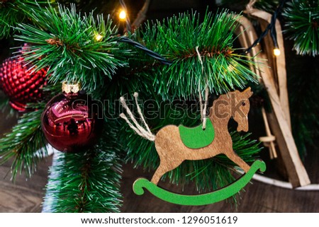 Christmas tree with wooden horse ornament