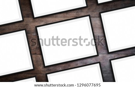 set of frames on wood background - blank picture frames mock-up