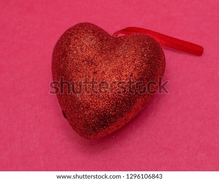 Red heart on a pink background. St. Valentine's Day Beautiful background from hearts. Concept of love and romance. Love background.