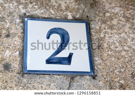Number Two on Tile at Door