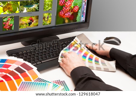 Graphic designer at work. Color samples. Photo picture fruit and nature